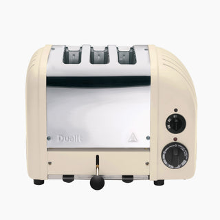 Cream-colored AWS cream Dualit 3 slot toaster with black knobs on a white background_1